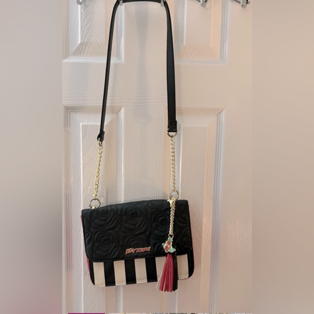 Betsy Johnson red black white purse. Has long strap..